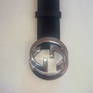 Gucci black canvas belt with silver interlocking g’s.
